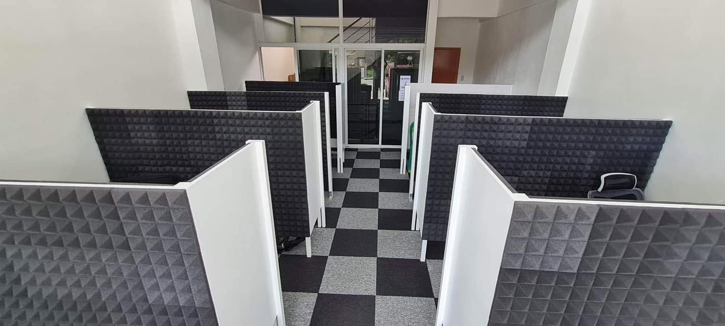 Open view of coworking space pods and entrance